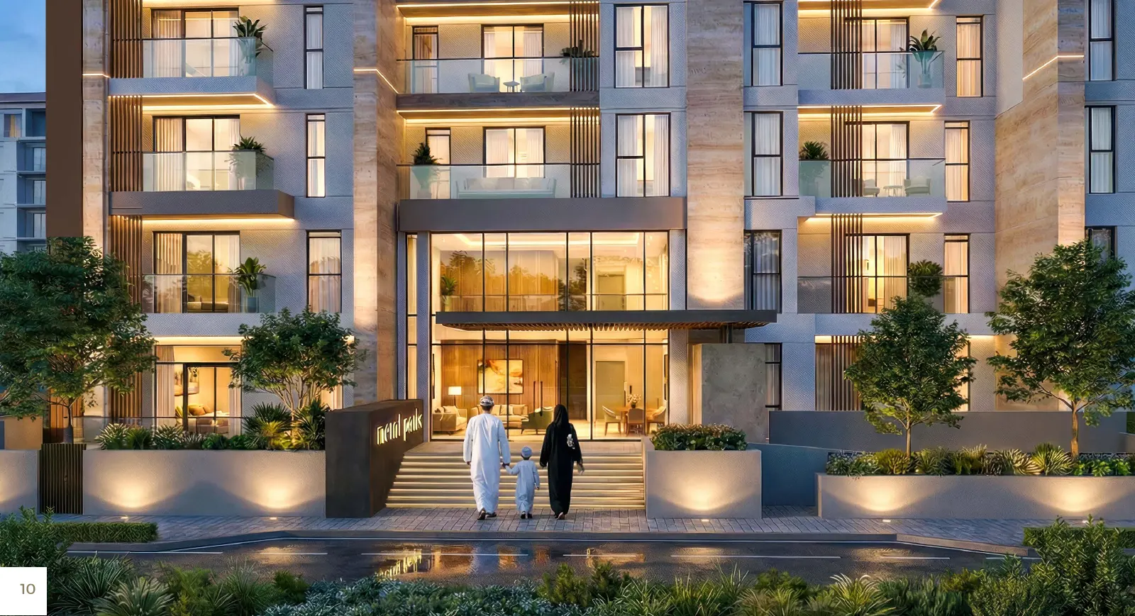 Illuminated main entrance of a Sky Park residential building