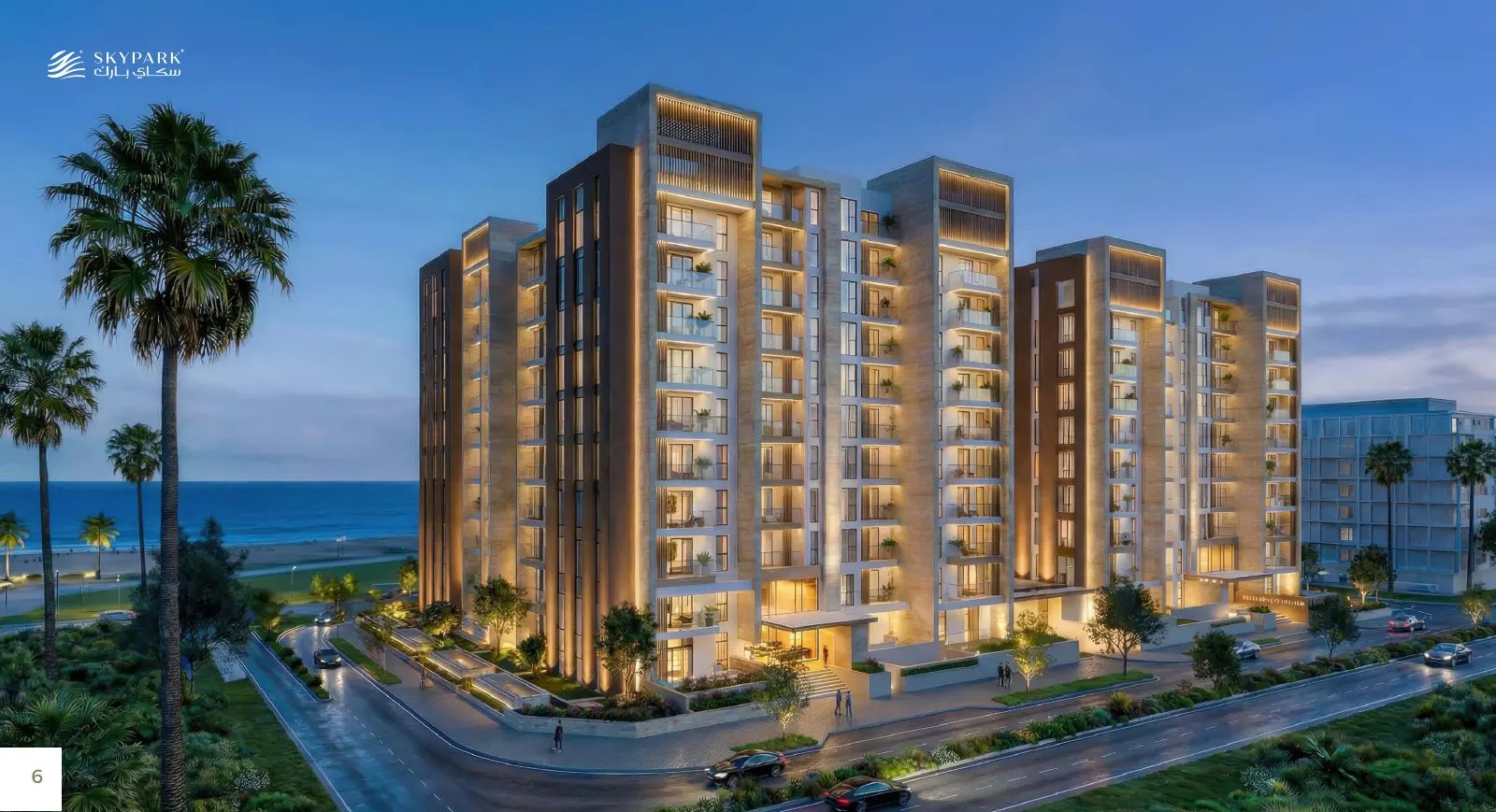 Sky Park apartment buildings at dusk with palm trees and sea in the background